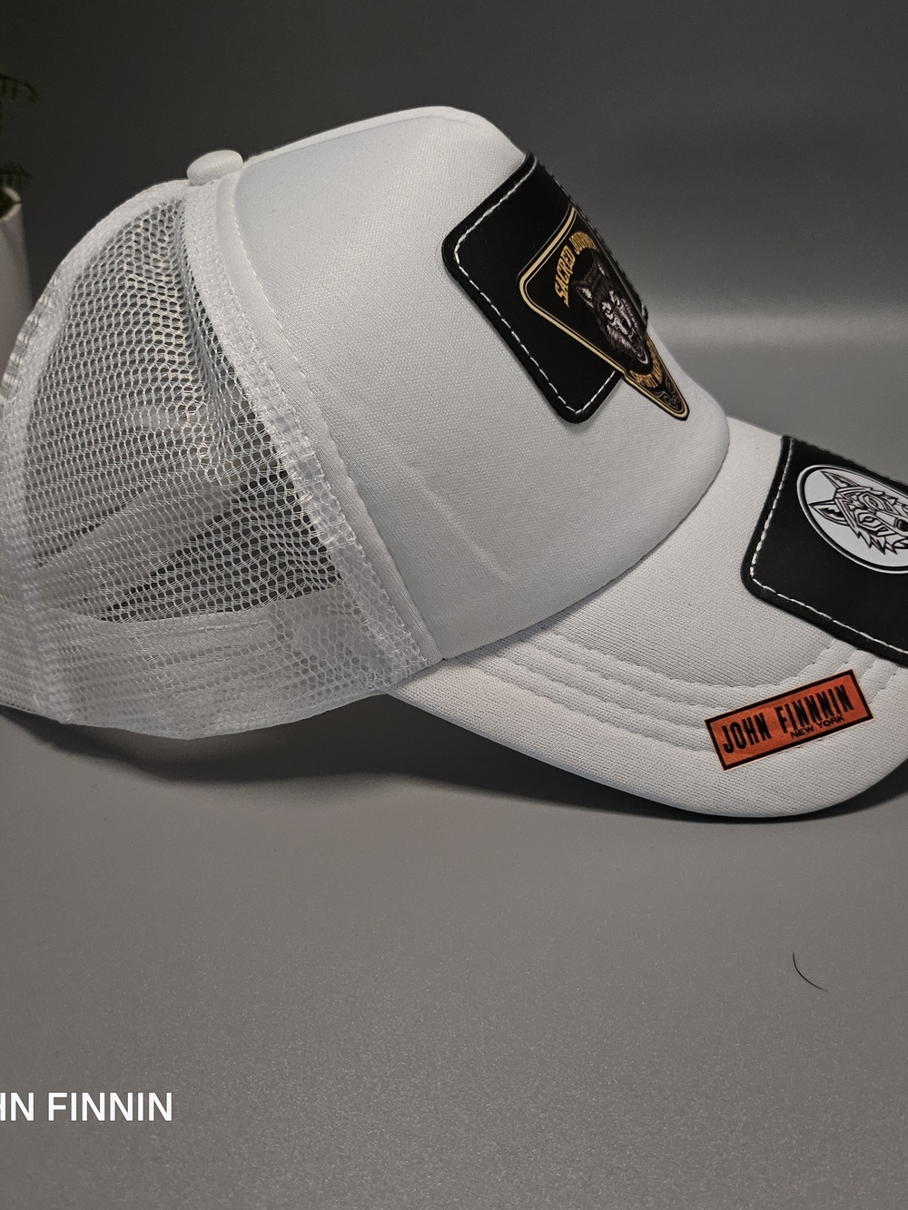 White Mesh Patch Trucker Cap with Orange Logo Patch